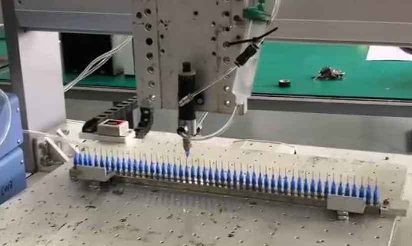 Applying UV adhesive to the needle head
